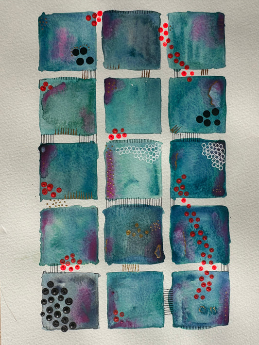 Close-up of teal squares with red dots and black stitched lines.