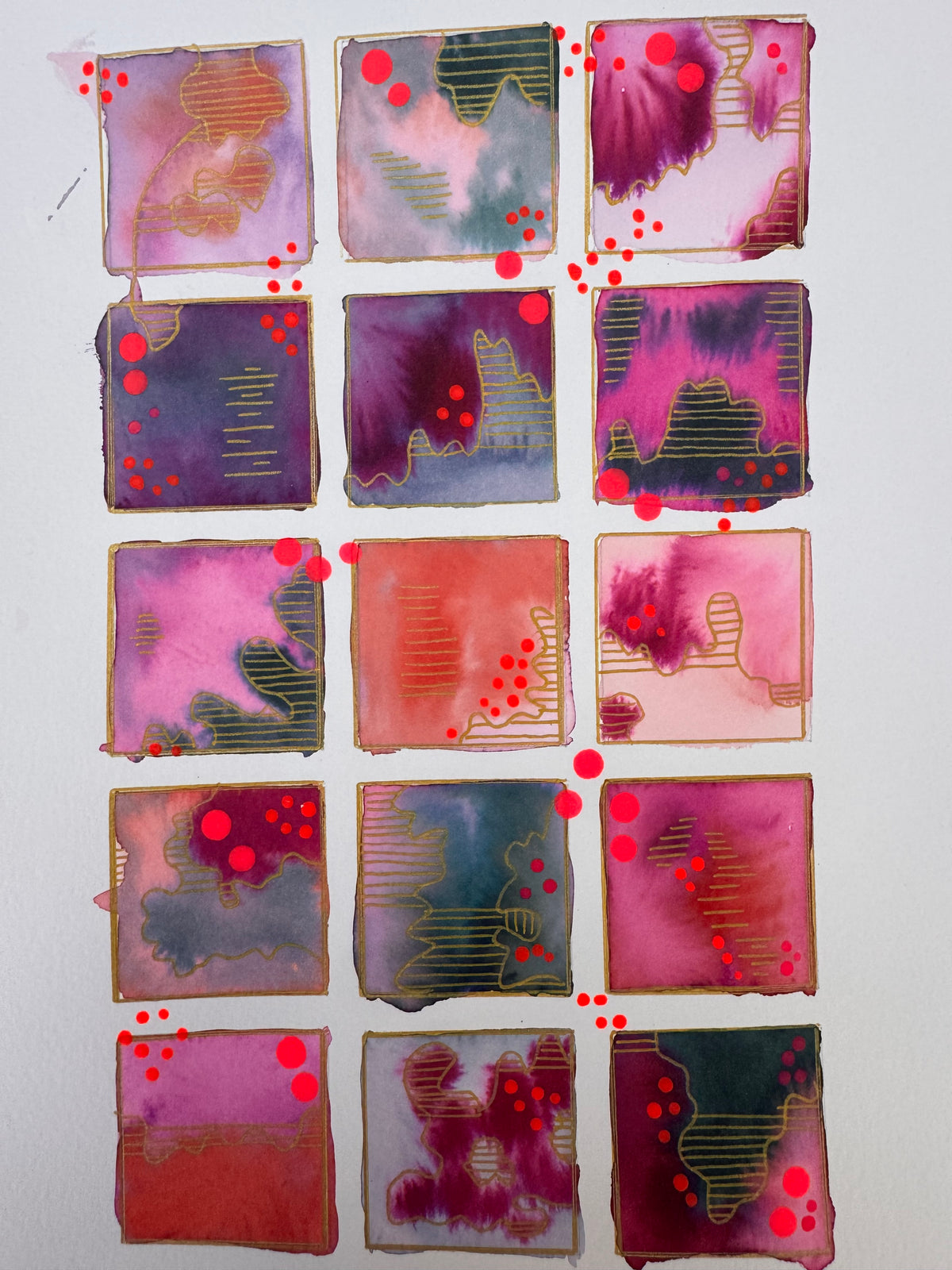 Watercolour painting of fifteen magenta, plum, coral and slate squares in a grid, each outlined in gold, with gold-striped contour shapes and bright pink dots.