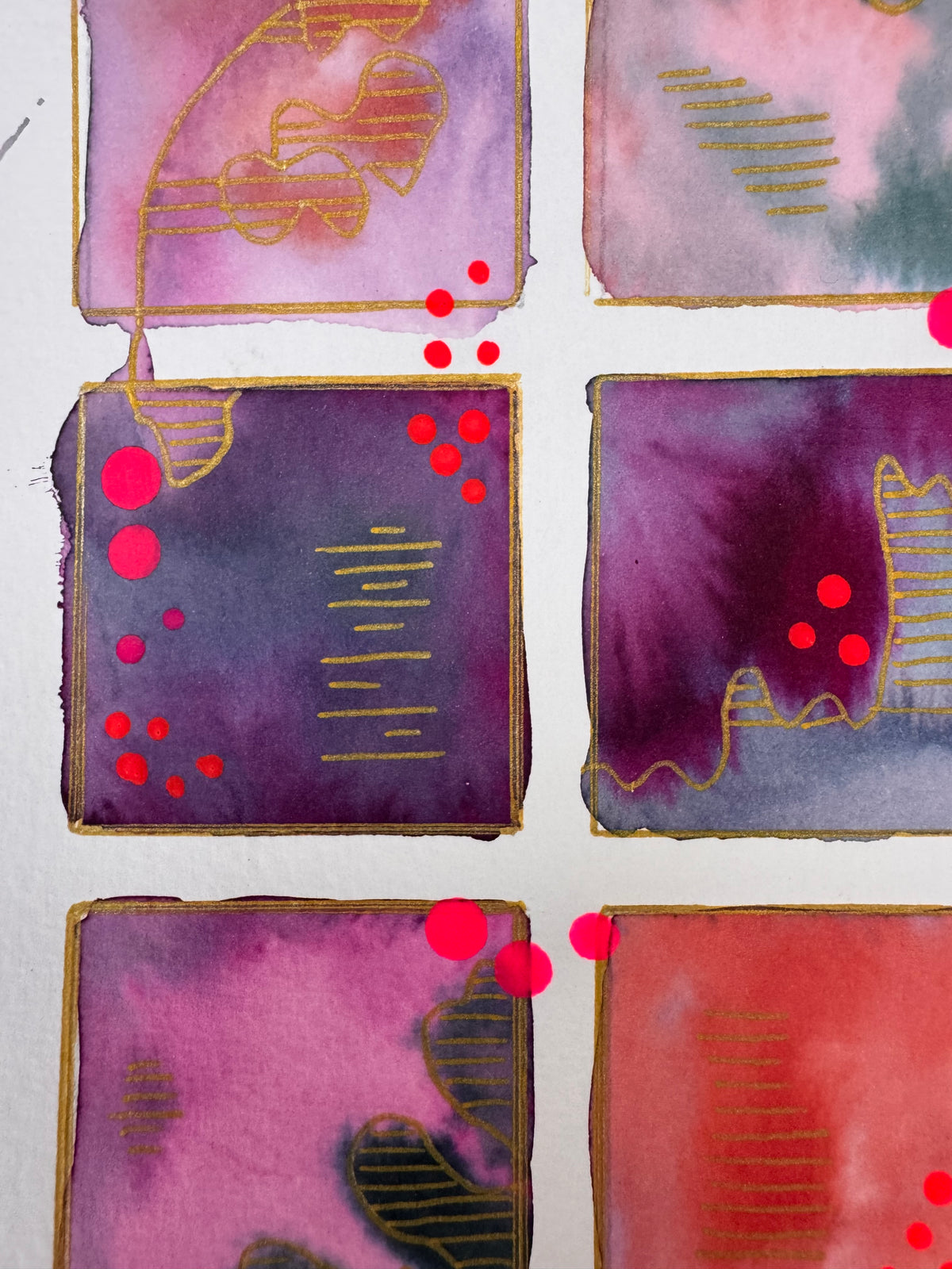 Watercolour painting of fifteen magenta, plum, coral and slate squares in a grid, each outlined in gold, with gold-striped contour shapes and bright pink dots.