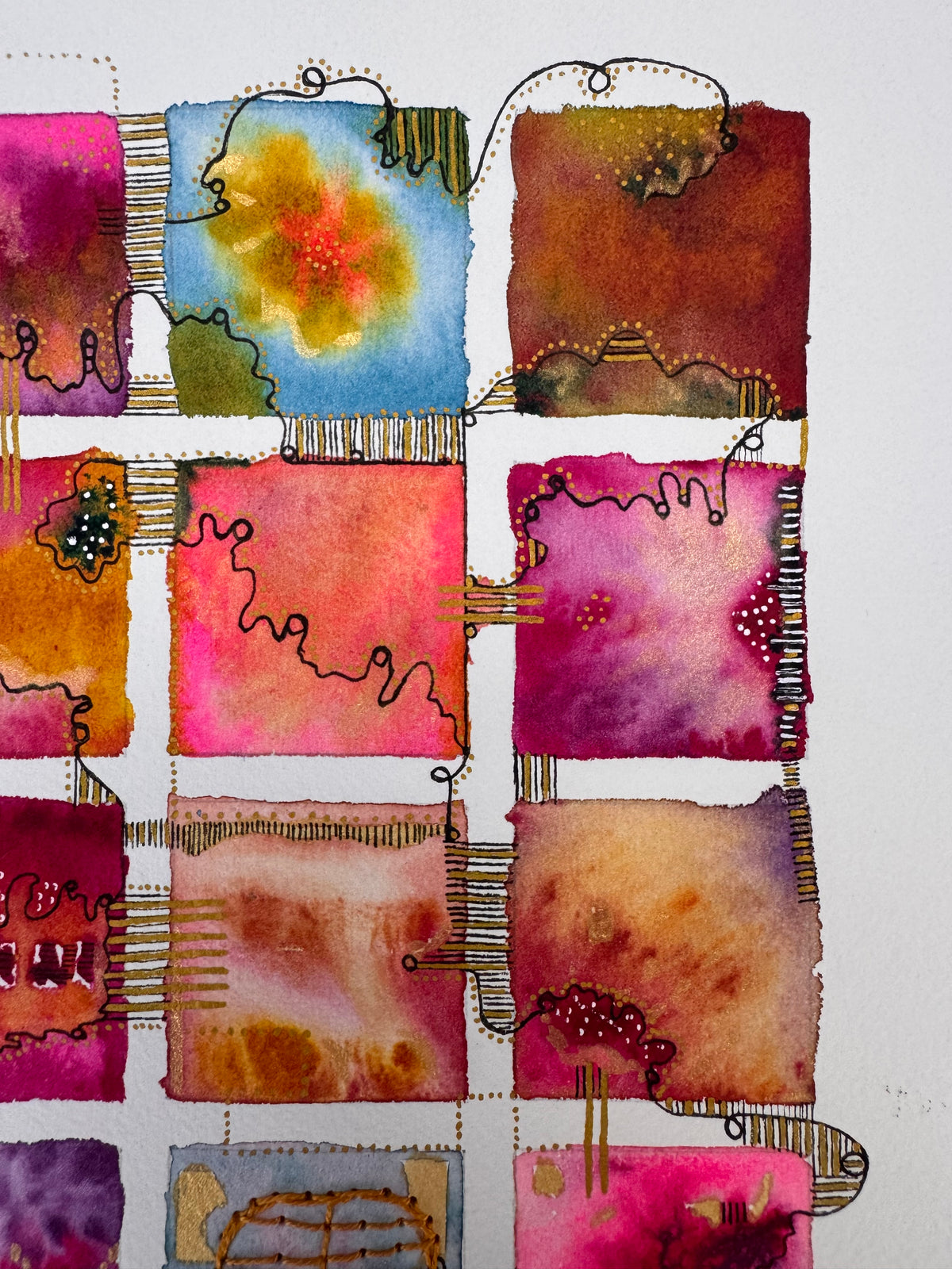Watercolour painting of fifteen hot pink, orange, crimson and blue squares in a grid, linked by a looping black line and gold dots, with gold patches and a hand-stitched ochre thread grid in the centre square.