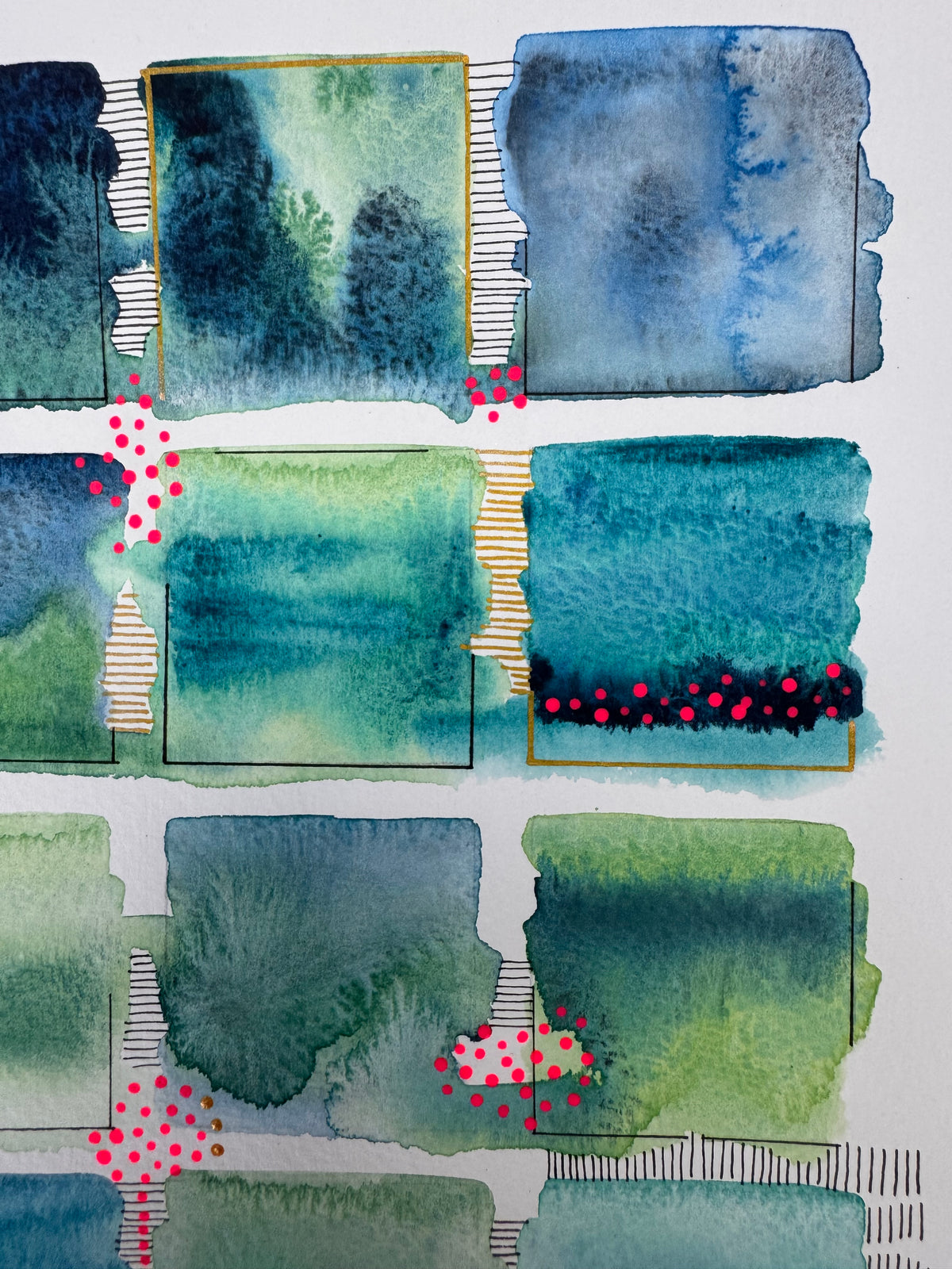 Watercolour painting of fifteen green, teal and blue squares in a loose grid with soft bleeding edges, fine black corner lines, two gold-edged squares, and clusters of bright pink and gold dots.